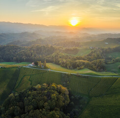 Wall Mural - aerial sunset landscape of the picturesque, autumn-covered rolling hills near maribor, close to the 