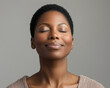 © Kseniya - Close-up portrait of a beautiful Black woman with radiant skin and a confident smile, exuding natural beauty and positivity, perfect for beauty, wellness, and lifestyle concepts