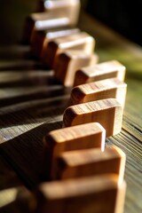 Poster - A collection of wooden blocks placed on a wooden table, ideal for use in educational or office settings