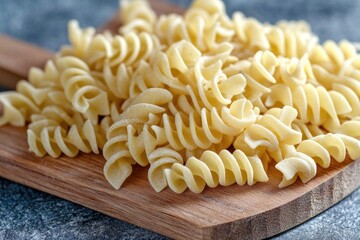 Wall Mural - Fresh pasta arranged on a wooden cutting board for cooking or serving