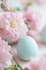 Wall Mural - Beautiful pastel blue eggs surrounded by pink flowers in a soft spring setting