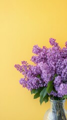 Wall Mural - Bright lilac flowers in a clear vase against a vibrant yellow background