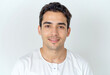 © f_bossa - A commercial portrait photo of a model on a white studio background:  a man in a white shirt smiling at the camera against a white background.