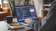 © Ozgurluk Design - Programmer Working on Code in a Home Office