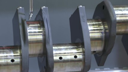 Poster - The metal crankshaft of the engine rotates during testing and servicing