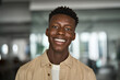 © insta_photos - Close up portrait of young adult confident happy Black man student or company employee, smiling African guy professional entrepreneur, office worker standing indoors looking at camera. Headshot.