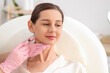 © Pixel-Shot - Young girl receiving filler injection in beauty salon