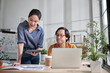 © tigercat_lpg - Two young Asian startup company partners disagreeing opinions argue in small business office, disappointed profit marketing plan jobs, and freelance work as E-commerce entrepreneur and coworker team.
