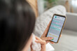 © Kawee - Close up of woman patient using phone apps consulting doctor online.