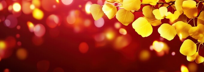 Poster - Golden leaves with bright bokeh on dark background.