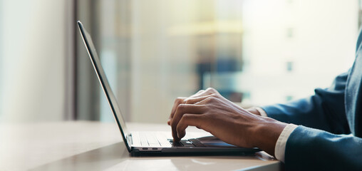 Poster - Businessman, hands and laptop in office for typing, economy research and ecommerce. Trader, man and computer in agency on cryptocurrency platform, stock market review and networking for information