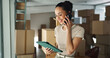 © peopleimages.com - Phone call, supply chain and woman on tablet with boxes for shipping, online orders and ecommerce. Business, startup and person talking for production, distribution or delivery logistics in factory