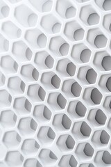 Poster - Close-up of a white honeycomb pattern showcasing textured geometric shapes and a sleek, modern design.