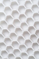 Poster - Close-up of a white honeycomb pattern showcasing intricate geometric shapes and textures.