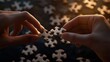 © siriporn - A close-up of hands connecting puzzle pieces in a cooperative effort,