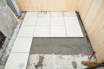 Wall Mural - A cement slab is being laid down in a small area