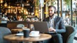 © Junior - A businessman sitting in a modern coffee shop with a laptop and coffee, attending a virtual meeting or conference call. This scene is ideal for business, remote work, and productivity content.