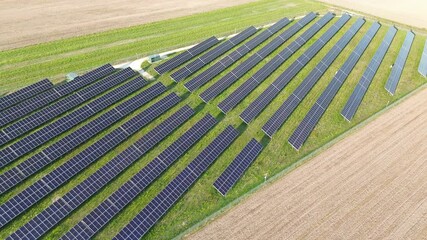 Wall Mural - Aerial view of solar panel array in countryside