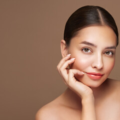 Wall Mural - portrait beautiful young woman with clean fresh skin. model with healthy skin looks at an empty spac