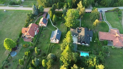 Wall Mural - House and garden nestled in forest aerial view