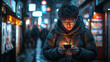 © D-stock photo - young asian man using mobile phone in the street at night, lifestyle people concept