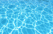 © Ice Cream Paradise - Natural light on water (close-up): A serene image of the shimmering water surface in an empty swimming pool, the interplay of light and shadow creating organic patterns on the tiled bottom