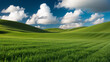 © janzwolinski - Green rolling hills and lush grass creating a stunning landscape under a cloudy sky