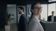 © Chanaka - The selected candidate is smiling in the office background.