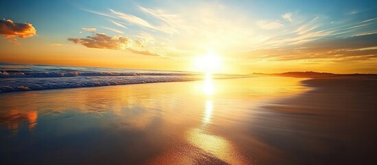Poster - Golden sunset reflected on wet sand along tranquil shoreline creating a serene coastal landscape.