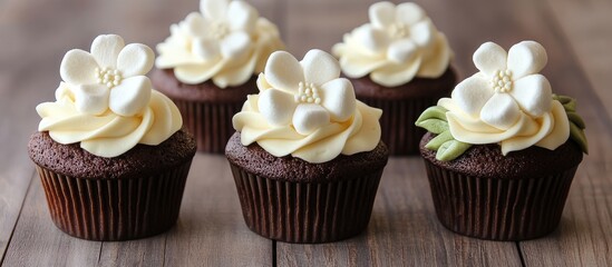 Poster - Elegant chocolate cupcakes topped with buttercream and marshmallow flowers on a rustic wooden table showcase delightful dessert presentation.