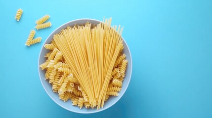 Aufkleber - Variety of Spaghetti Types in Bowl with Blue Background Culinary Concept Top View Fresh Ingredients for Cooking Italian Dishes