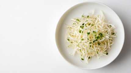 Poster - Dish of fresh sprouted onions garnished with microgreens on a clean white background for culinary and health-focused imagery.