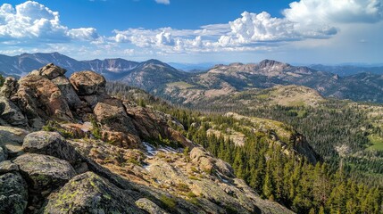 Aufkleber - Dramatic mountain landscape featuring rocky summits and expansive views of peaks under a bright blue sky with fluffy clouds