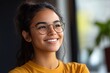 © HISTOCK - Young latin woman wearing glasses smiling and looking up with hope