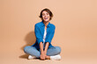 © deagreez - Full body length photo of young office manager woman in blue shirt laughing good mood relax atmosphere isolated on beige color background