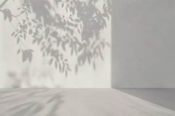 Poster - minimalist interior scene featuring soft shadows of leaves cast on a light wall creating a serene and peaceful atmosphere.
