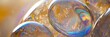 © jahanzaib - Detailed magnified view of transparent soap bubbles with rainbow reflections