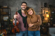© Miljan Živković - Portrait of boyfriend and girlfriend with violin at home