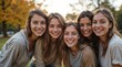 © NoblePix - Group of multiethnic young people having fun outdoors and smiling at the camera