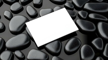 Poster - Blank Business Card Template on Smooth Black Pebbles Background