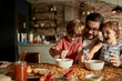 © Davor - Father and kids enjoying messy pancake breakfast together