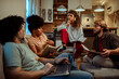 © Davor - Group of young people studying together in modern home