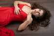 © Peter Ivanov - Lying female model on a wood floor