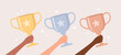 © Alrika  - Hands of people of different skin tones holding shiny golden, silver and bronze trophy cups on a beige background, flat vector illustration