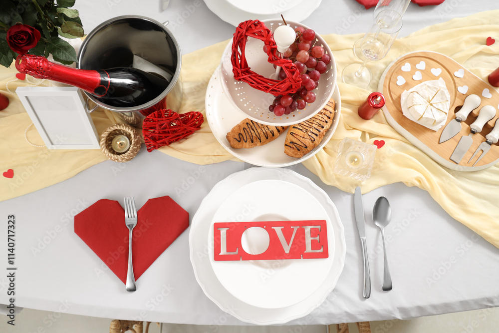 Table setting for Valentine's Day with hearts and word LOVE