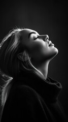 Poster - A serene black-and-white portrait of a woman with her head tilted back, eyes closed.