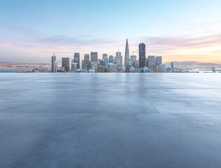 Poster - A city skyline at dawn with a clear foreground and soft pastel sky.