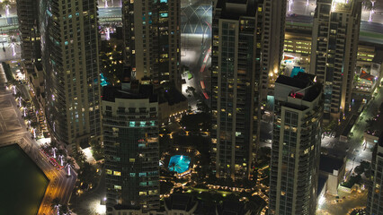 Wall Mural - Dubai downtown night with city lights from above timelapse