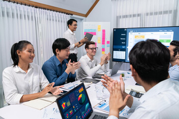 Leinwandbilder - Happy office worker and project manager celebrate in meeting room after successfully achieving business task on time and on schedule. Project management tracking software for business success. Prudent