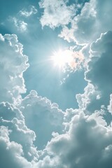 Wall Mural - Bright sunlight filters through fluffy clouds in a clear blue sky